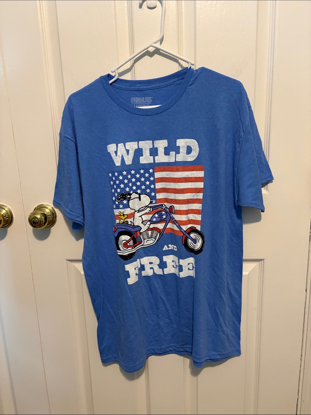 Unisex Peanuts Blue 'Wild and Free' Short Sleeve Tee with Snoopy Motorcycle